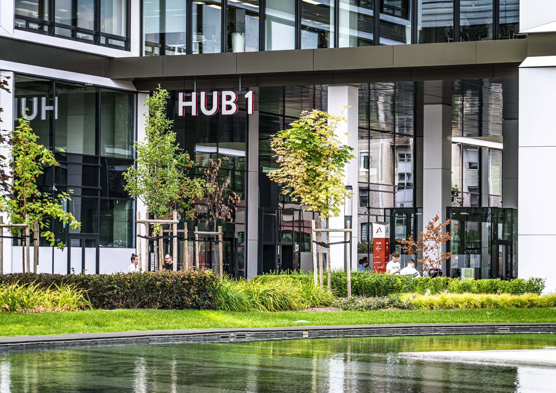 Landscaped entrance and reflecting pool at Agora HUB1 in Budapest