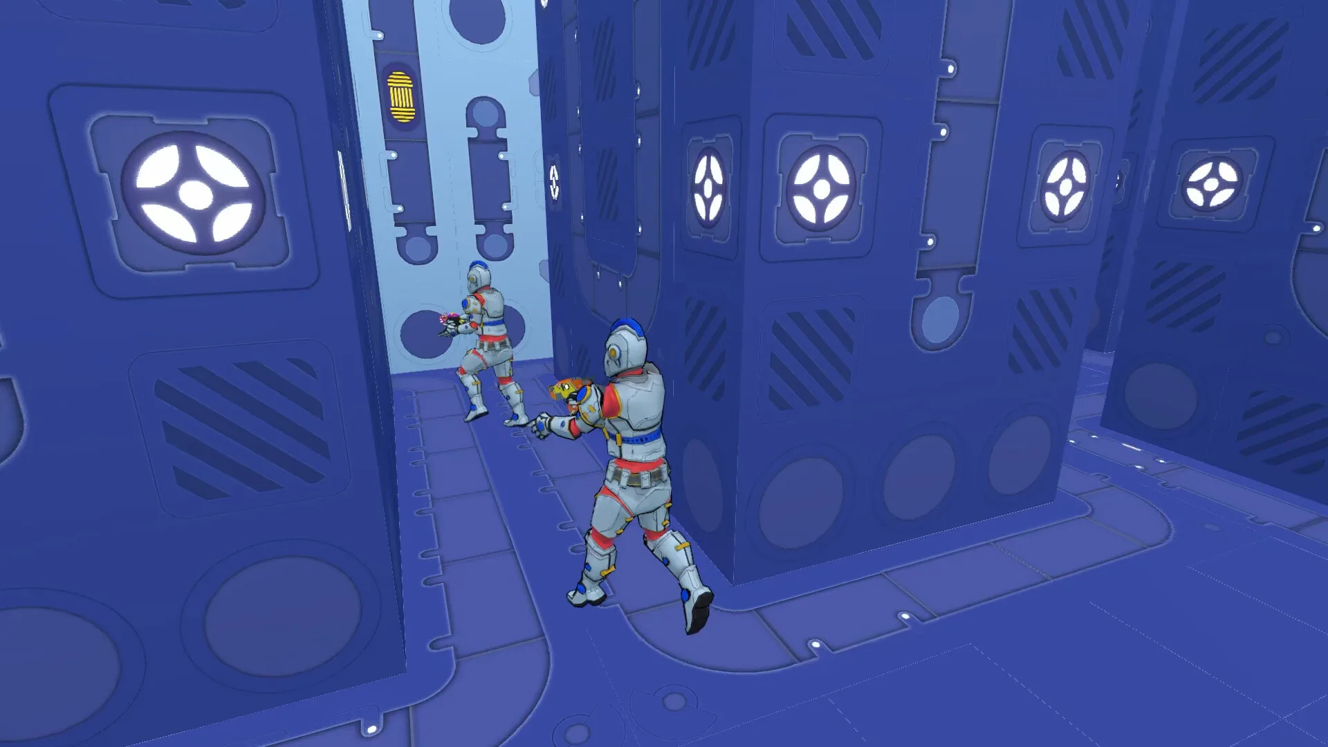 Two VOXSYS players duelling between blue voxel cover blocks